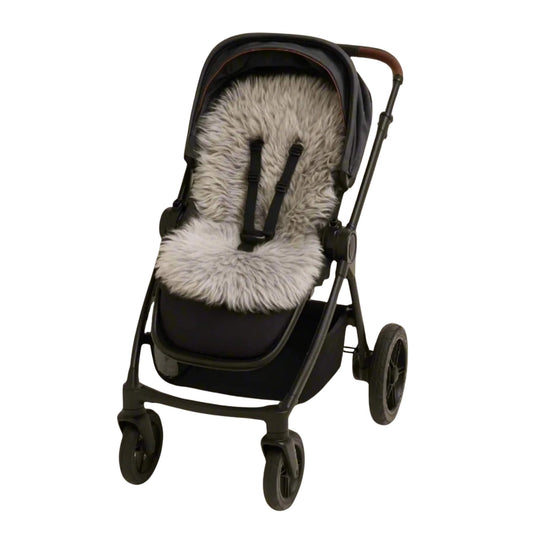 Grey sheepskin pram liner fitted neatly into a black pushchair seat with harness straps visible.