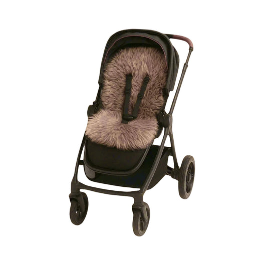 Black stroller fitted with a taupe sheepskin pram liner, the soft wool covering the seat and backrest.