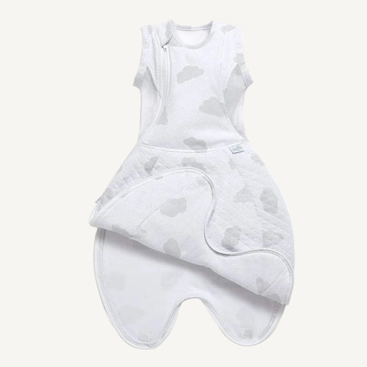Swaddle sleep bag laid flat, opened at the bottom, showing full shape with enclosed feet, quilted lower body and pale grey cloud print fabric.