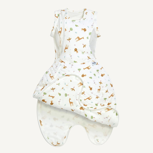 A swaddle to sleep bag opened to show a wrap-style front panel folded back, revealing a lighter inner lining and leg-shaped lower section.