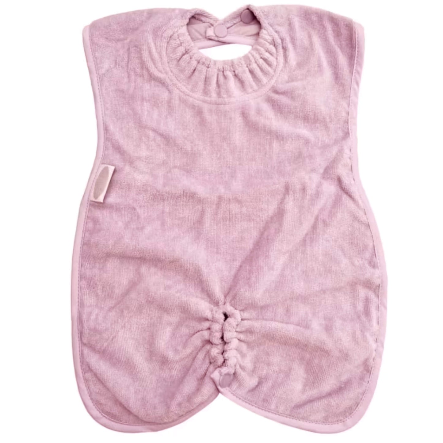 Silly Billyz Highchair Hugger Towel Bib in Antique Pink, showing a soft towelling bib with elasticated neck opening, popper fastening at the back, and a gathered base designed to catch dropped food during highchair meals.