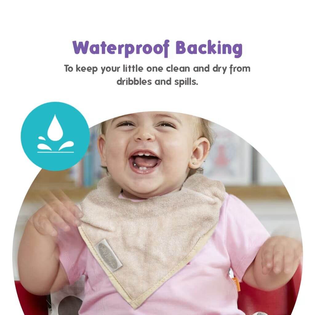 Happy baby wearing Silly Billyz towel bandana bib in white sand, featuring a waterproof backing to keep clothes clean and dry from dribbles and spills."