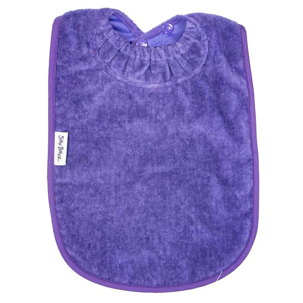 Purple Silly Billyz Towel XL Bib provides extra-large coverage with a soft, absorbent front and waterproof backing to keep messes under control.
