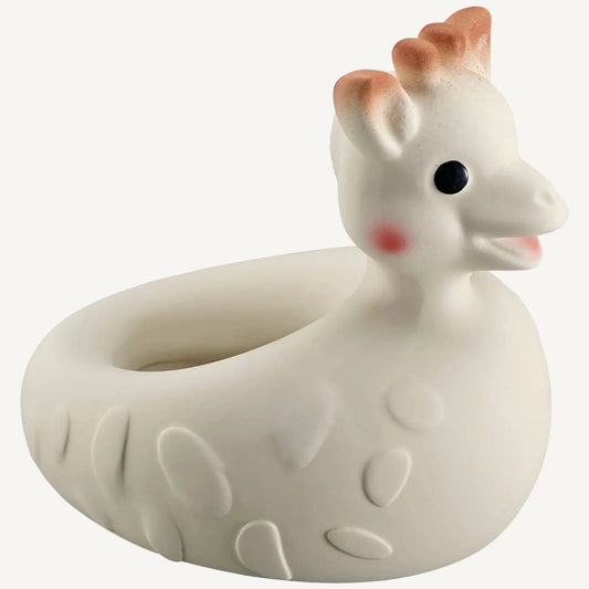 Natural rubber giraffe bath toy shaped as a floating ring with raised textured details and a smiling giraffe head.