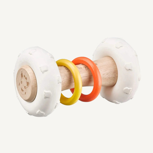 Side view of a wooden rattle showing textured natural rubber ends and coloured rings threaded around a central handle.
