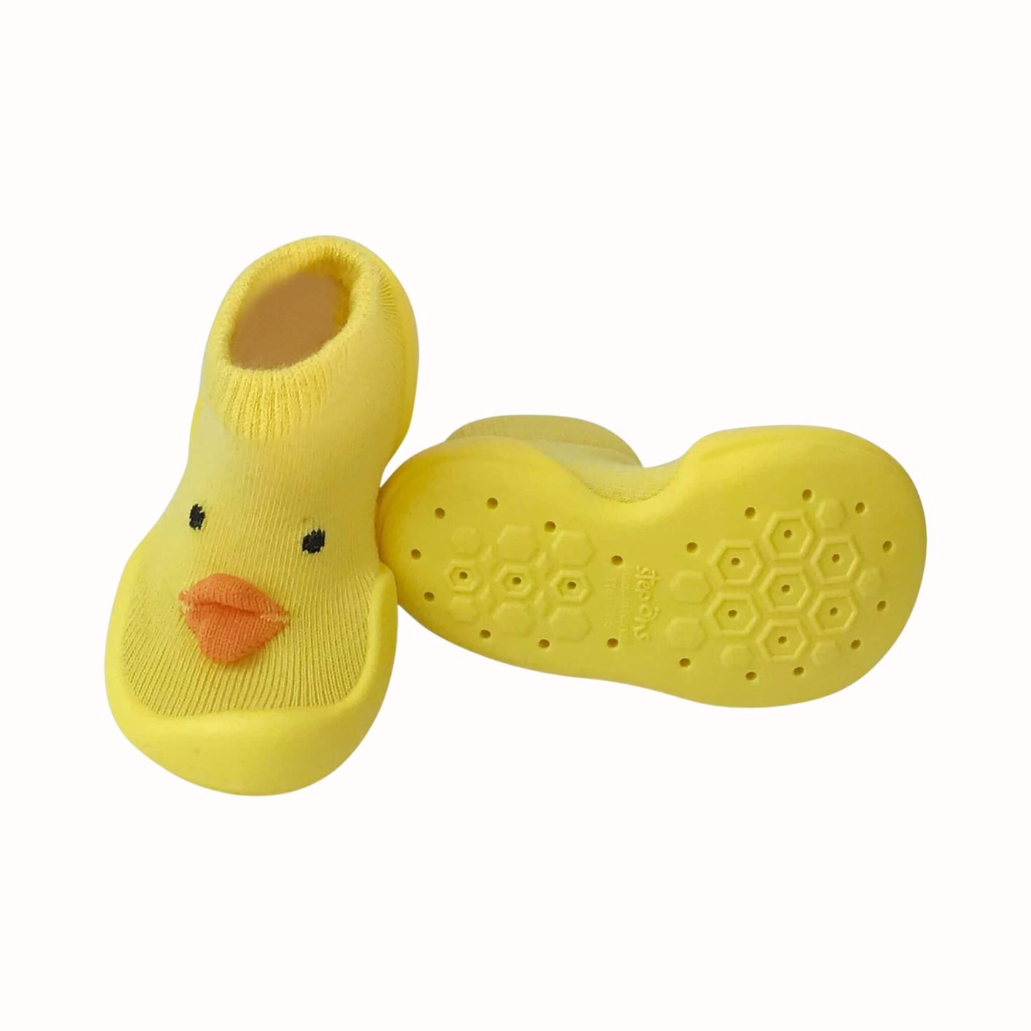 Yellow chick Step Ons shown from the front and sole, with orange beak detail, soft knitted upper and grippy non-slip sole pattern.