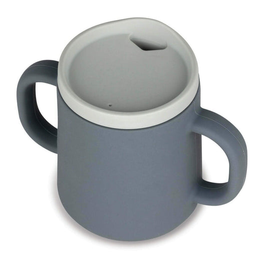 A grey silicone trainer cup fitted with a recessed rim transition lid designed for sipping without a straw.