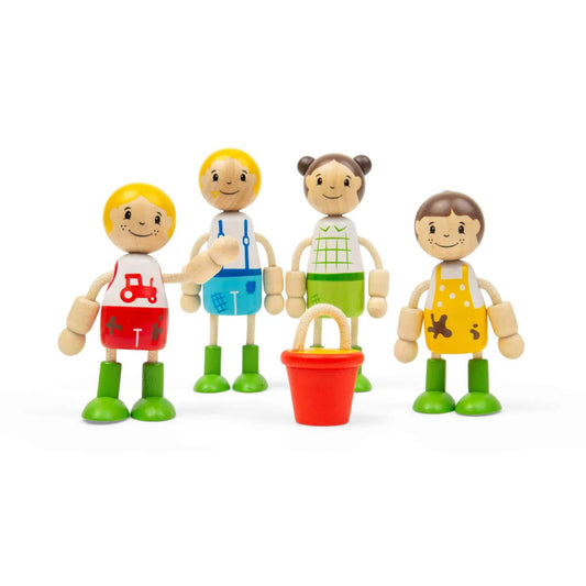 Four wooden farm family dolls standing around a red bucket, with one child figure holding an arm out towards the group.