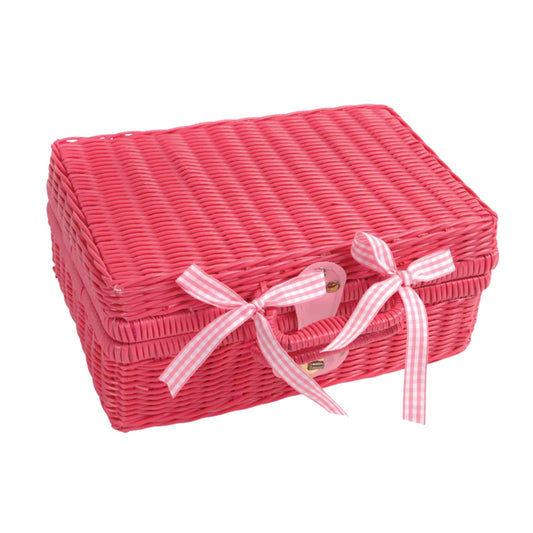 Closed pink wicker picnic case tied with gingham ribbon bows, showing the neat, portable design of the tea set when packed away.