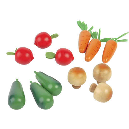 Wooden toy vegetables including carrots, radishes, mushrooms and courgettes arranged on a white background as part of a children’s play food set.