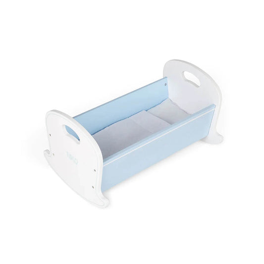 Tidlo’s cosy Doll Cradle. The rocking base adds to the lifelike touches of the cradle and the blue polka dot design gives it a homely feel.