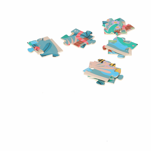 Animated GIF of scattered wooden puzzle pieces showing tropical designs with fish, leaves and sea creatures in soft blues and corals.
