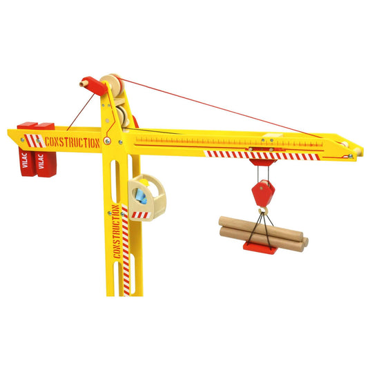 Close-up of a large toy yellow wooden crane with a working winch, magnetic hook, and detailed construction-themed design.
