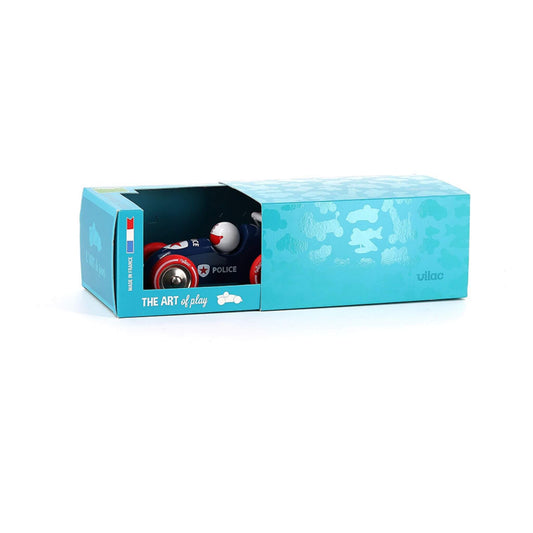 Toy police pull-along race car in attractive turquoise packaging with "THE ART of play" branding, showcasing the wooden toy partially visible in box.