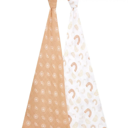 Full-length view of aden + anais Keep Rising swaddles featuring warm-toned rainbow and sunburst prints on airy cotton fabric.