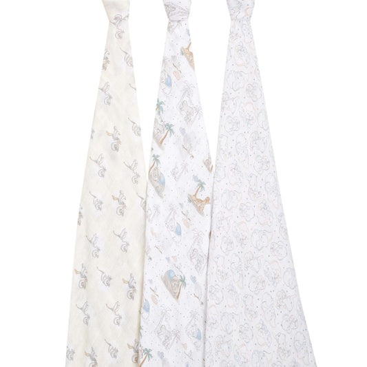 Three aden + anais cotton swaddles hanging to show full Dumbo-inspired prints with palm trees, stars, and soft neutral colours.