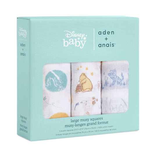 Boxed set of three aden + anais Disney Baby muslin squares with Winnie the Pooh prints in a mix of gold, blue, and white.