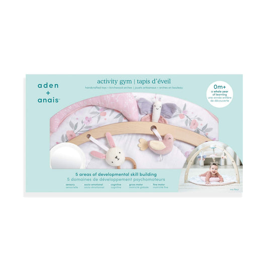 packaging of aden + anais baby activity gym Ma Fleur edition highlighting developmental skill areas and muslin mat
