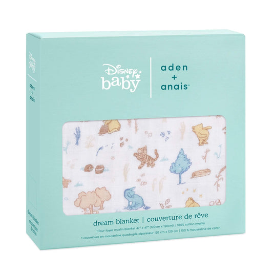 Boxed aden + anais Disney Baby Dream Blanket with a whimsical Winnie the Pooh woodland design in muted tones, shown in turquoise packaging.