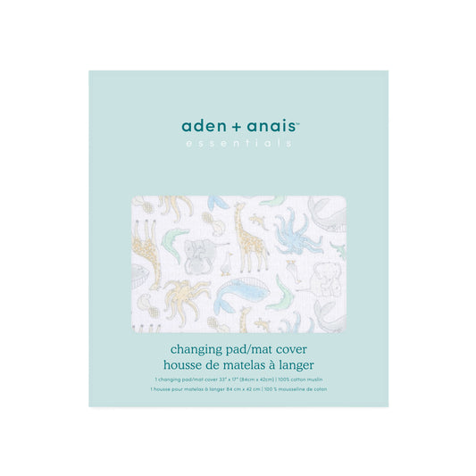 Aden + Anais Essentials changing mat cover in its packaging, showing product details and natural history animal print design.
