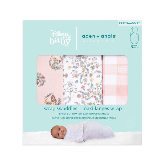 Retail packaging showing three folded swaddles inside a rectangular box. The box is turquoise with Disney Baby and aden + anais branding, and includes an image of a baby wrapped in a swaddle at the bottom.