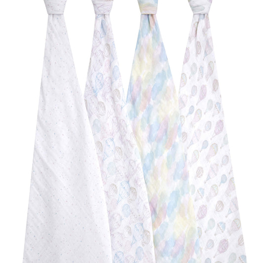 Four aden + anais organic cotton muslin swaddles displayed hanging, featuring pastel cloud and hot air balloon patterns. Breathable, lightweight, and gentle for baby.