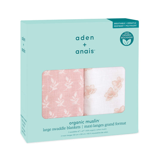 Full view of aden + anais Earthly organic cotton swaddles in pink and white floral designs. Lightweight and generously sized.