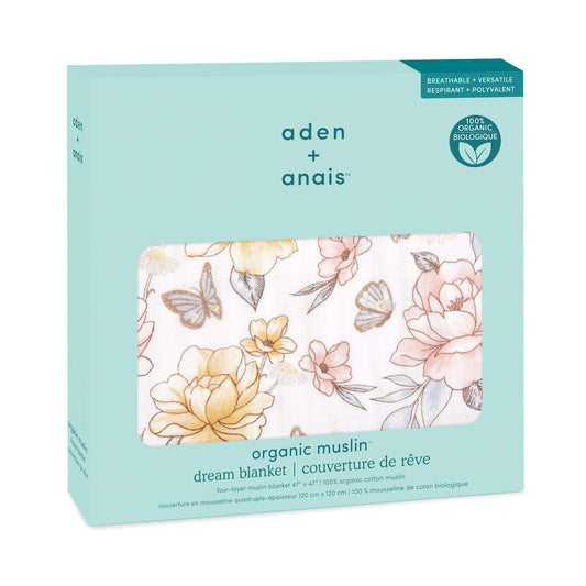 aden + anais organic cotton dream blanket in retail packaging. Features floral butterfly print and GOTS certified label on mint green box.