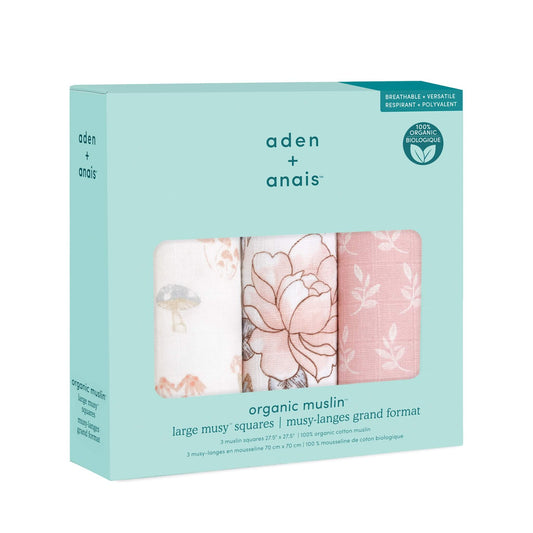 aden + anais Earthly collection in gift packaging, showing three organic cotton muslin squares with floral and nature-inspired designs.