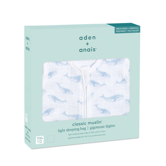 aden + anais light sleeping bag in Oceanic whale print, packaged in mint green box. Made from 100% cotton muslin, 1.0 TOG for breathable comfort.