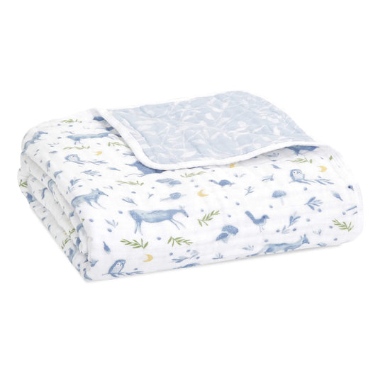 The aden + anais organic cotton muslin  dream blanket features four layers of muslin for a soft baby blanket. Its uses go beyond cuddling, as it also makes a  snuggly surface to lay your little one on.