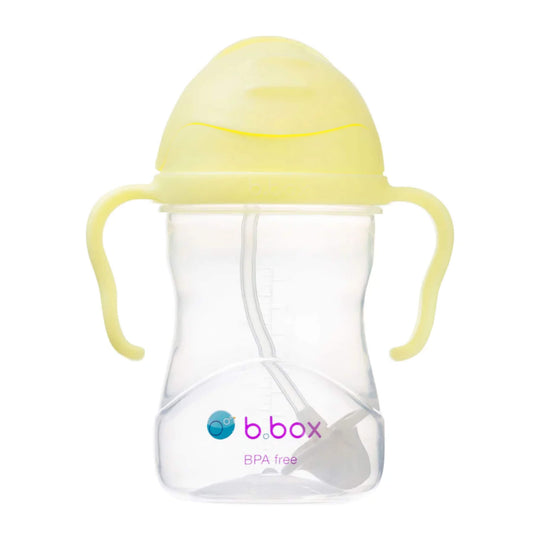 A yellow-lidded sippy cup shown with the flip-top lid closed, clear body visible, and curved handles on each side.