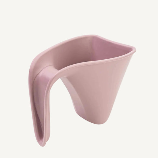 Soft pink baby bath jug with curved handle and gentle pouring edge designed for rinsing little hair during bath time.