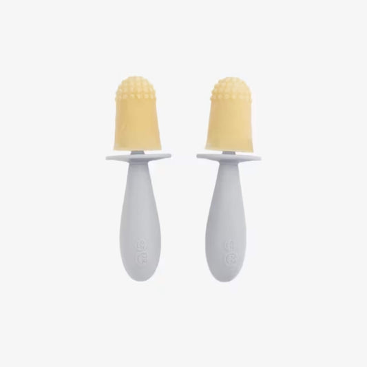 Two baby popsicle handles with textured silicone tips designed to soothe gums and provide frozen purée or milk for babies.