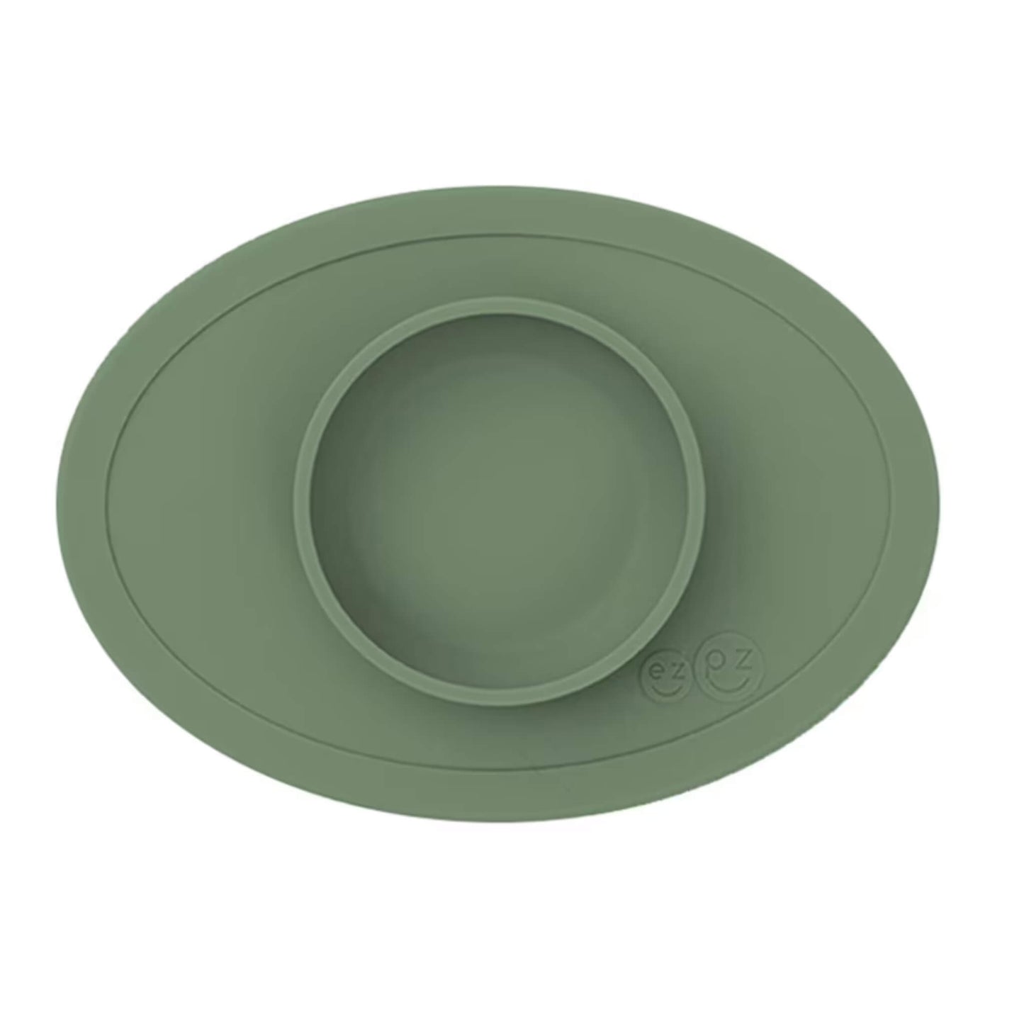 Ezpz Tiny Bowl in olive green, a silicone suction placemat with a built-in round bowl, shown empty against a plain background.