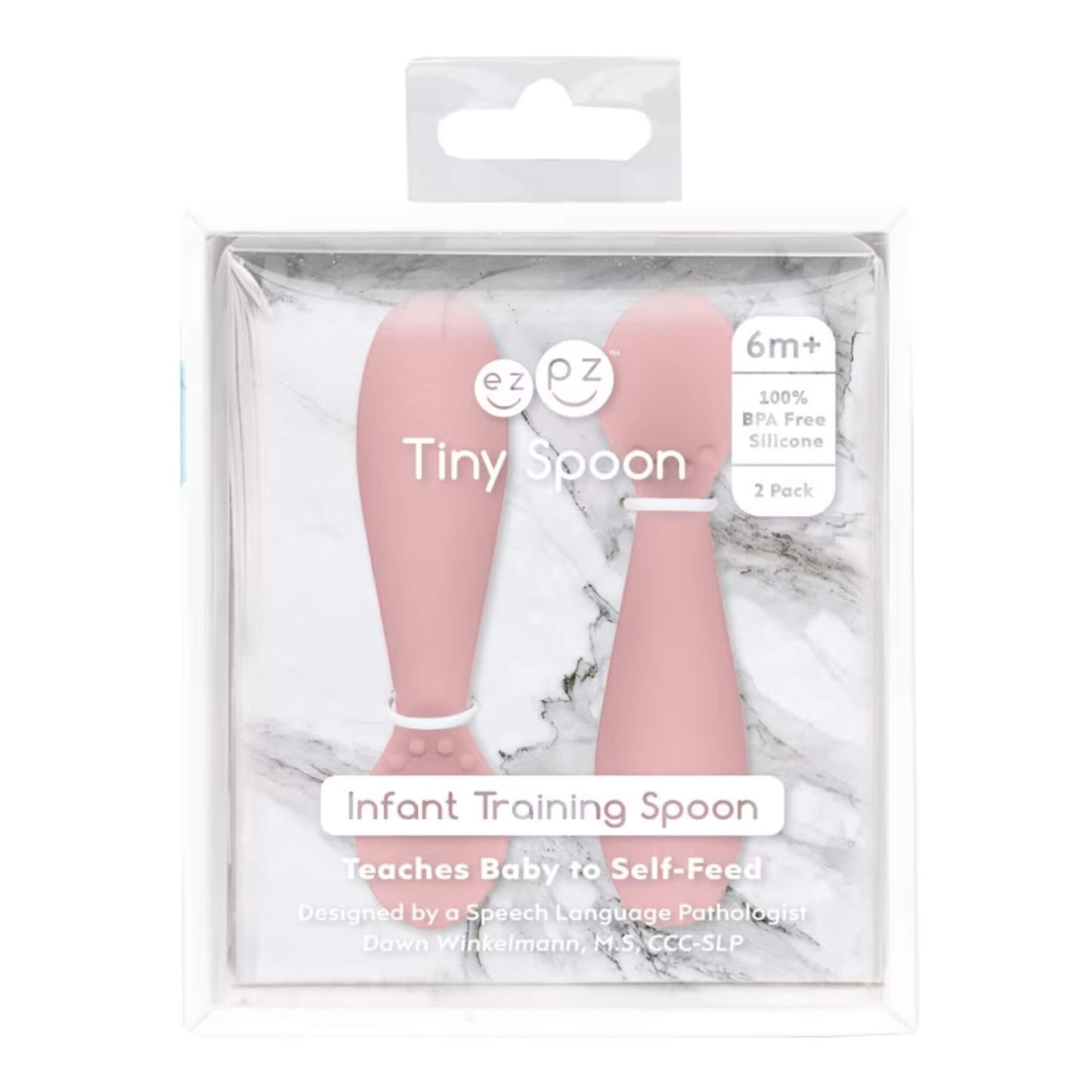 Retail packaging of Ezpz Tiny Spoons two-pack in blush pink, labelled “Infant Training Spoon” with product details on clear display box.