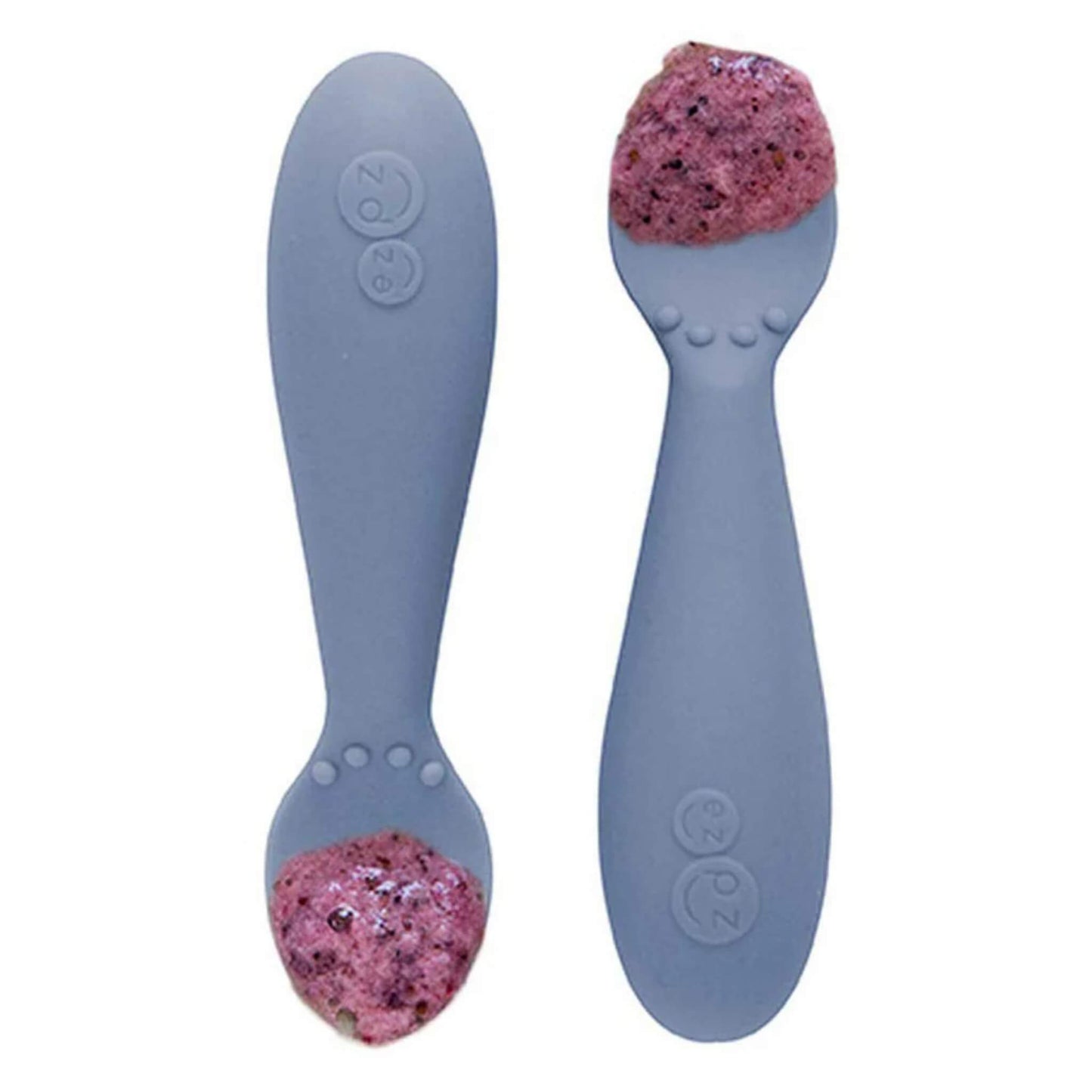 Pair of indigo blue silicone training spoons, filled with a serving of purple baby food, shown close-up.