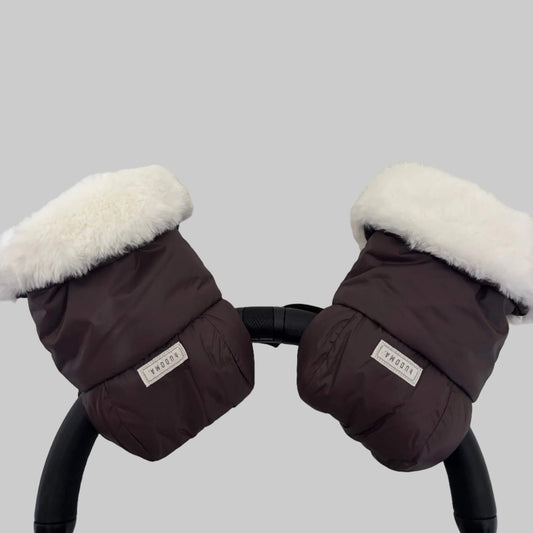 Pair of brown pram gloves attached to a stroller handle, with fluffy white faux fur lining visible around each cuff.