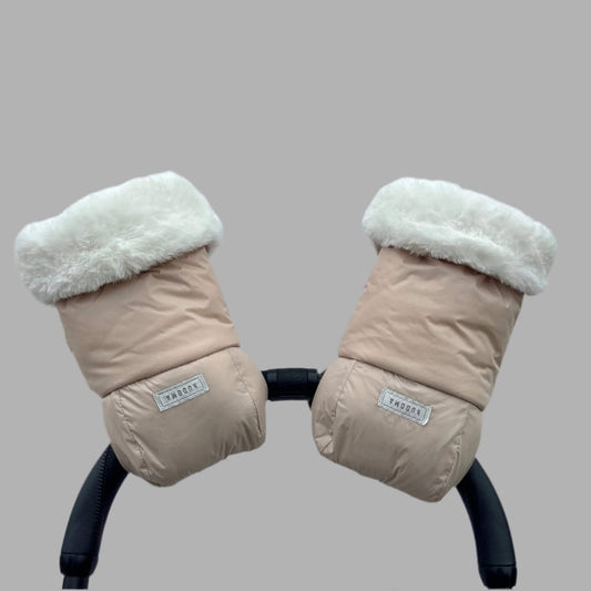 Beige pram gloves with white faux fur cuffs attached to a stroller handle, viewed from the front.