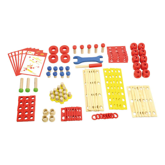 Assortment of wooden construction parts including bolts with green and blue tops, red wheels, yellow and red slats with holes, and small tools arranged neatly on a white background.