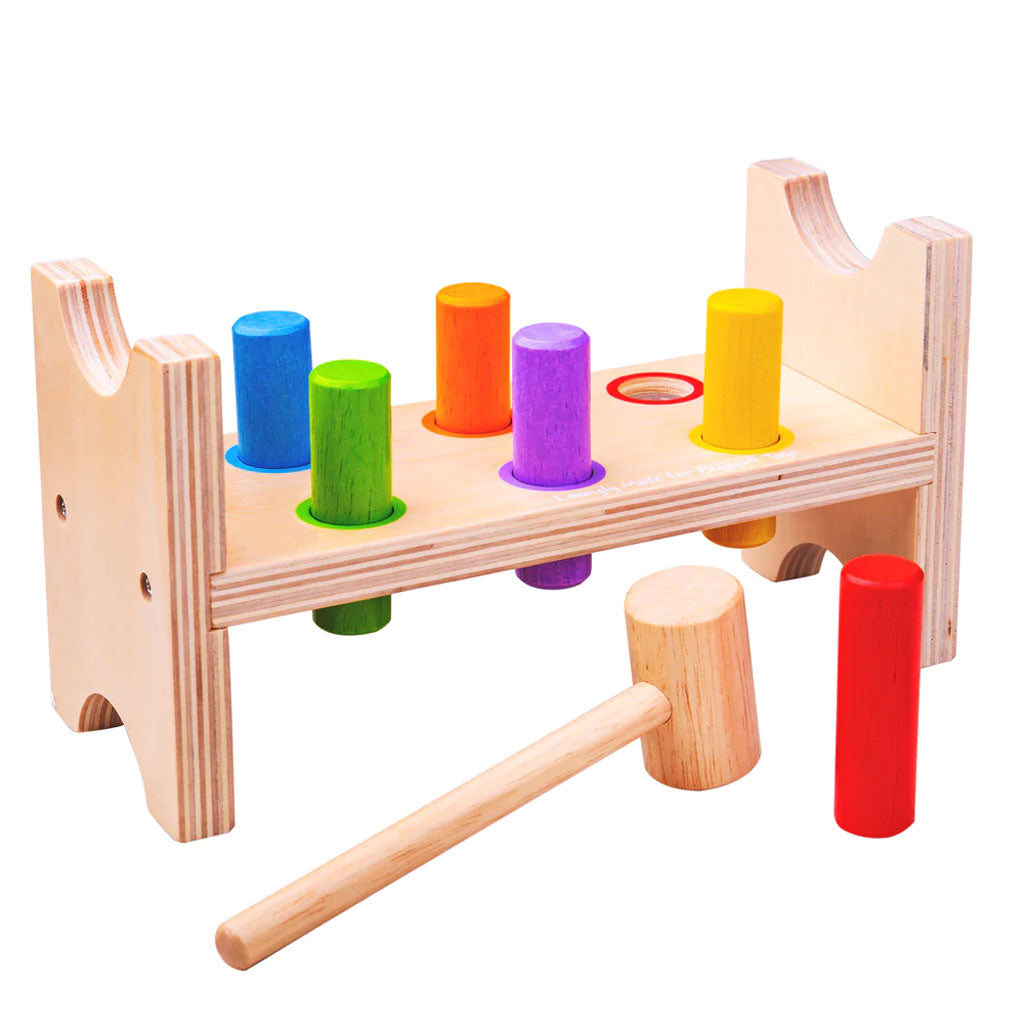 Developing hand/eye co-ordination has never been more fun than with the Bigjigs Toys Hammer Bench! Tap the brightly coloured wooden pegs down through the holes to create a flat workbench. Then, turn the whole thing over and start again!  This wooden Hammer Bench is supplied with a sturdy hammer and features gently curved edges.