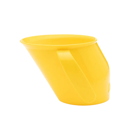 Side view of the slanted yellow Doidy Cup. Shows its angled design for natural sipping and early weaning support.