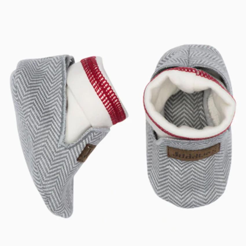 Juddlies Designs Slippers are designed with an inner sock, so they stay on those forever moving feet.
