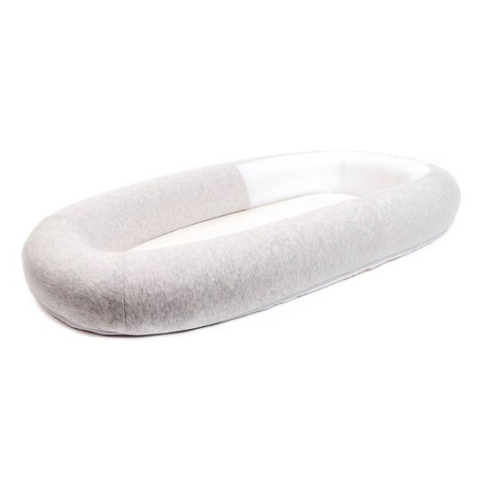 Side view of Purflo Sleeptight Baby Bed in minimal grey. Provides a cosy, breathable, and secure sleep space for baby.
