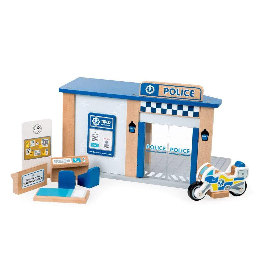 This open play wooden Police Station Toy offers endless play scenarios and comes complete with seven accessories, including a reception desk, dispatch desk, 2 chairs, cell beds, a suspect/line-up board and a police bike. Plus, a built-in jail with sliding doors and bar detailing.