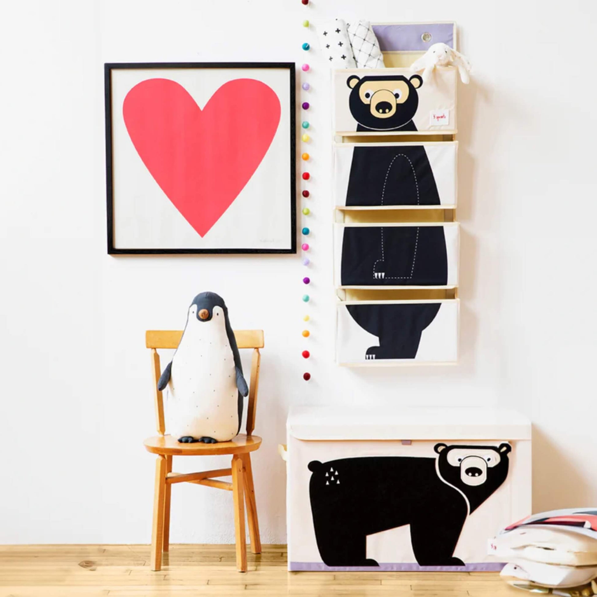 Bear organiser hanging on a wall above a matching 3 Sprouts storage box, styled with toys and decor in a bright, playful room.