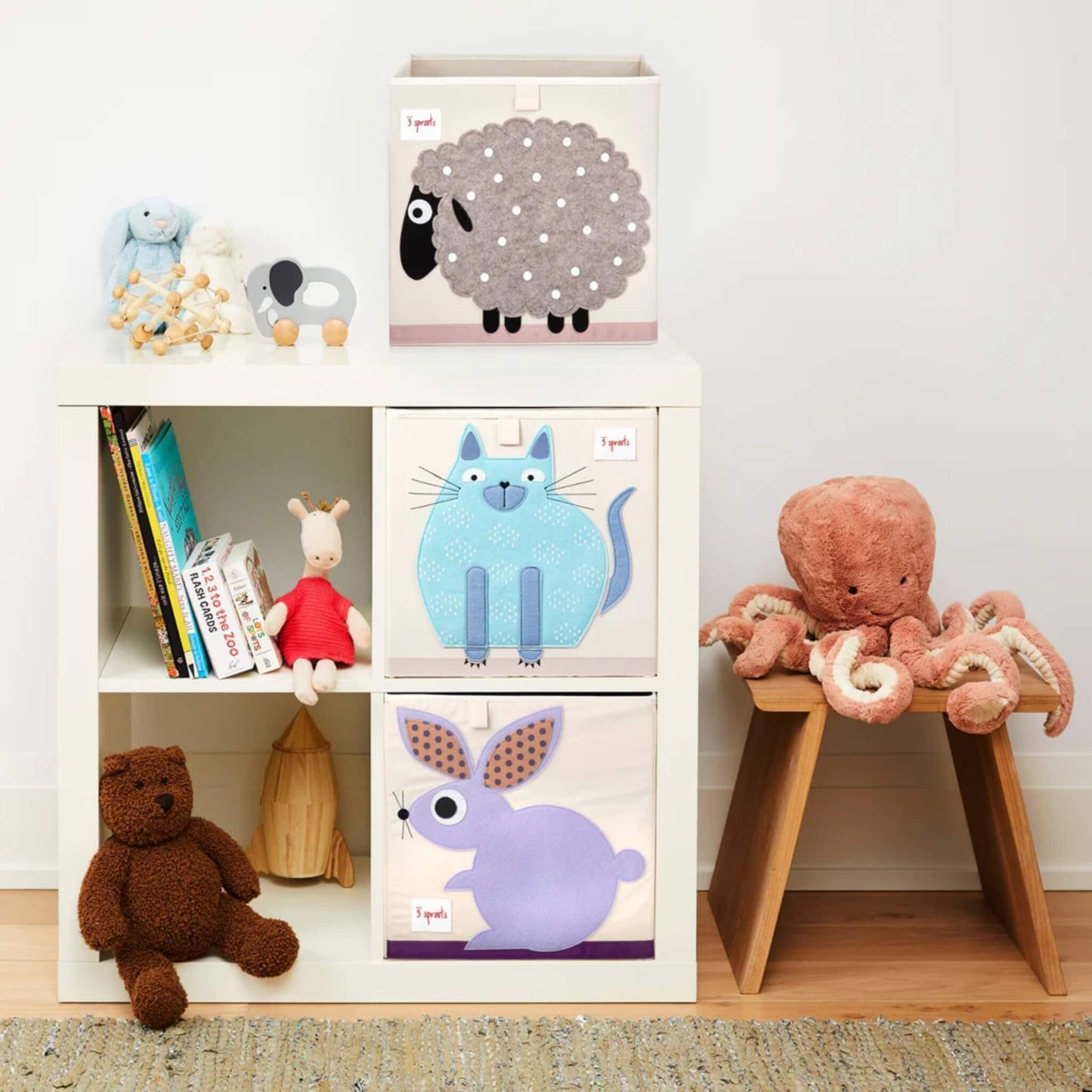 Blue Cat Storage Box styled in a cube shelf with matching Rabbit and Sheep boxes, surrounded by books, plush toys, and playroom decor.