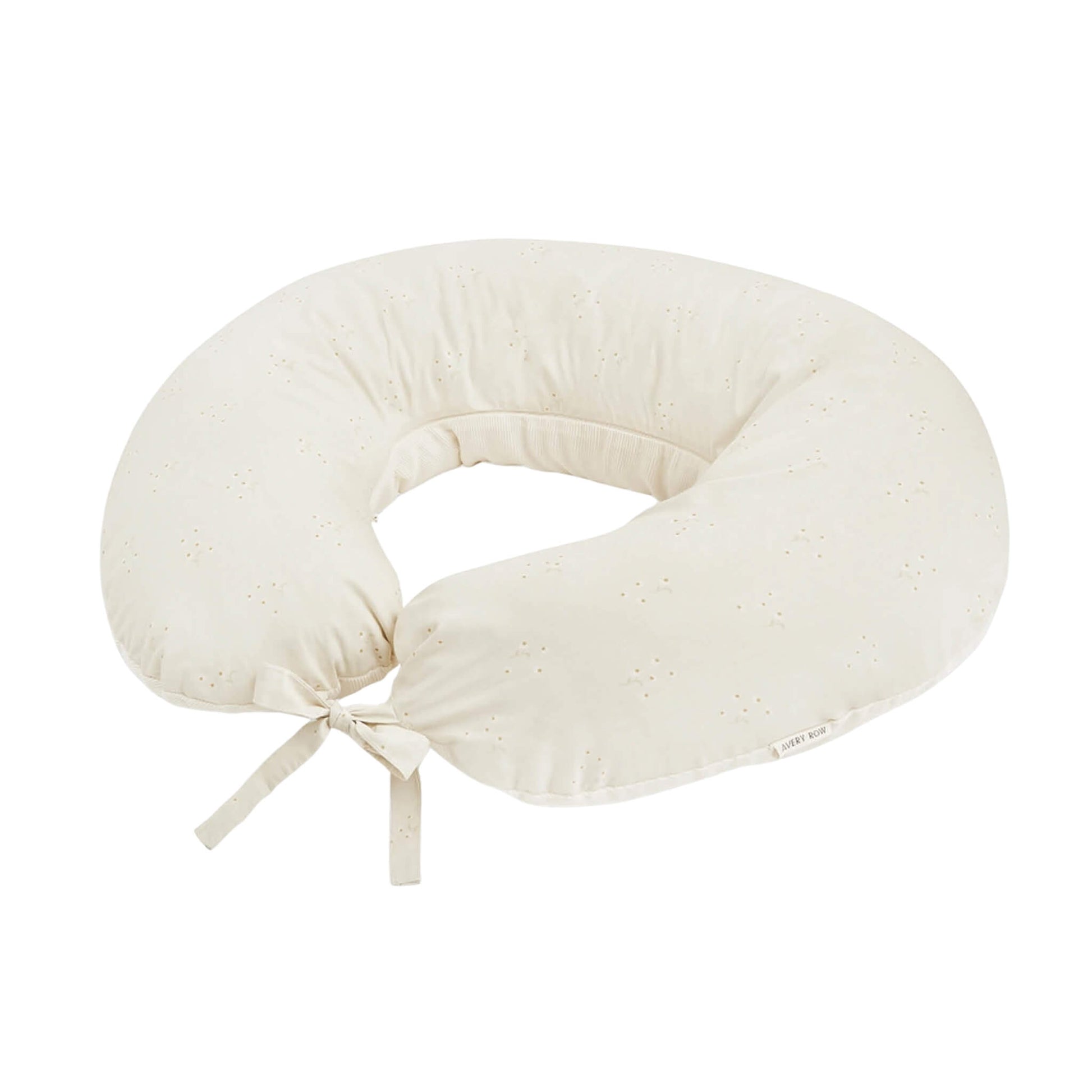 Avery Row Nursing Pillow in Wild Chamomile, with a curved supportive shape, organic cotton cover and tie fastening.