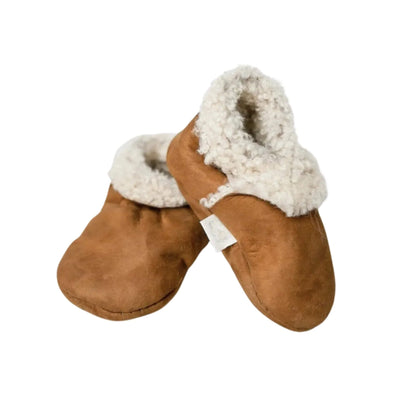 Pair of Baa Baby lambskin booties in tan with fluffy wool lining, shown standing side by side on a plain background.