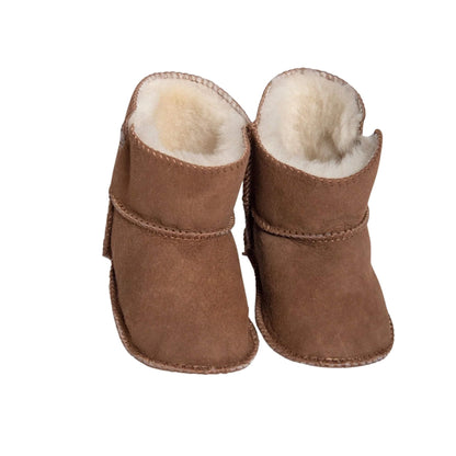 Front view of Baa Baby tabbed sheepskin booties in chestnut with soft wool lining and visible topstitch detailing.